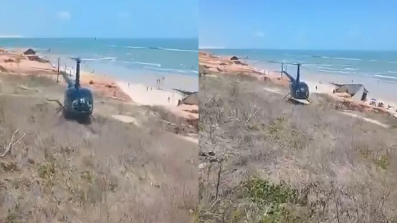 Helicóptero pousado sobre a formação de falésias em Canoa Quebrada.